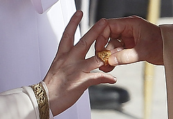 Pope Francis receives ring from Cardinal Sodano during inaugural Mass in St. Peter's Square at Vatican